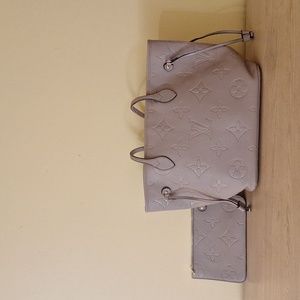 Louis Vuitton- matches any outfit- has original bag-  Gift from my mother.